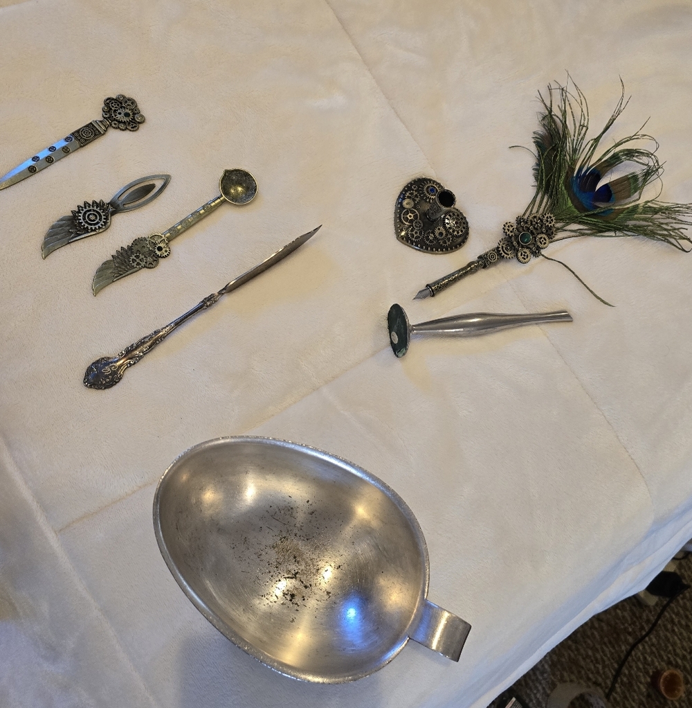 Silver Decorative Spoon Set With Some Sort Of Sugar Bowl